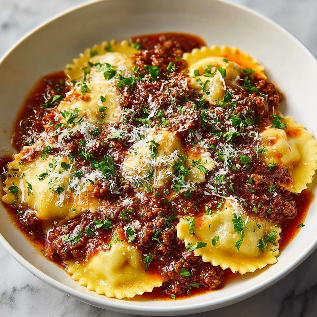 A white bowl filled with two layers of ravioli. The bottom layer is covered with rich red meat sauce that has chunks of ground meat and a slightly oily texture. On top, the ravioli pieces are light yellow with crimped edges, partially covered by more meat sauce and sprinkled generously with shredded white cheese. Green parsley leaves are scattered evenly on top, adding a fresh touch. The whole dish sits on a white marbled surface. Photo taken with an iphone --ar 1:1 --v 7